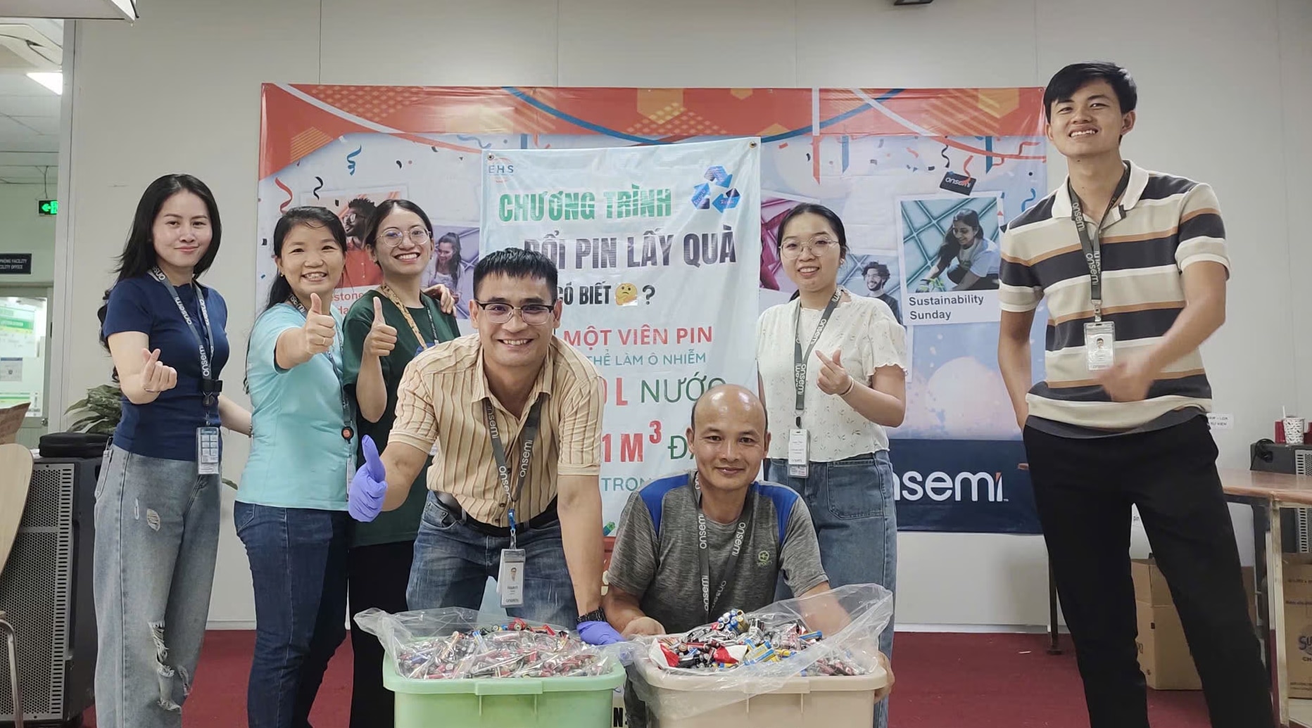 happy onsemi employees with exchange batteries for gift